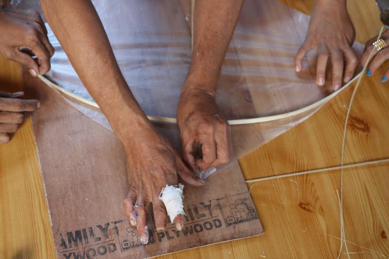 Myint Maung making a traditional Myanmar fighter kite 