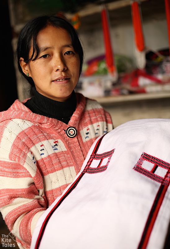 Athue holding her traditional Konyak shawl