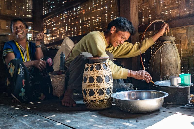  Sharing rice wine with guests (Picture by R. Horsey)